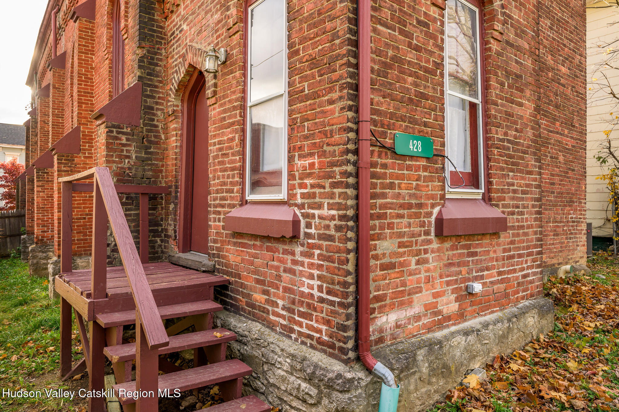 428 State Street Hudson, NY 12534 - Photo 22 of 23 a view of a buildings with wooden fence
