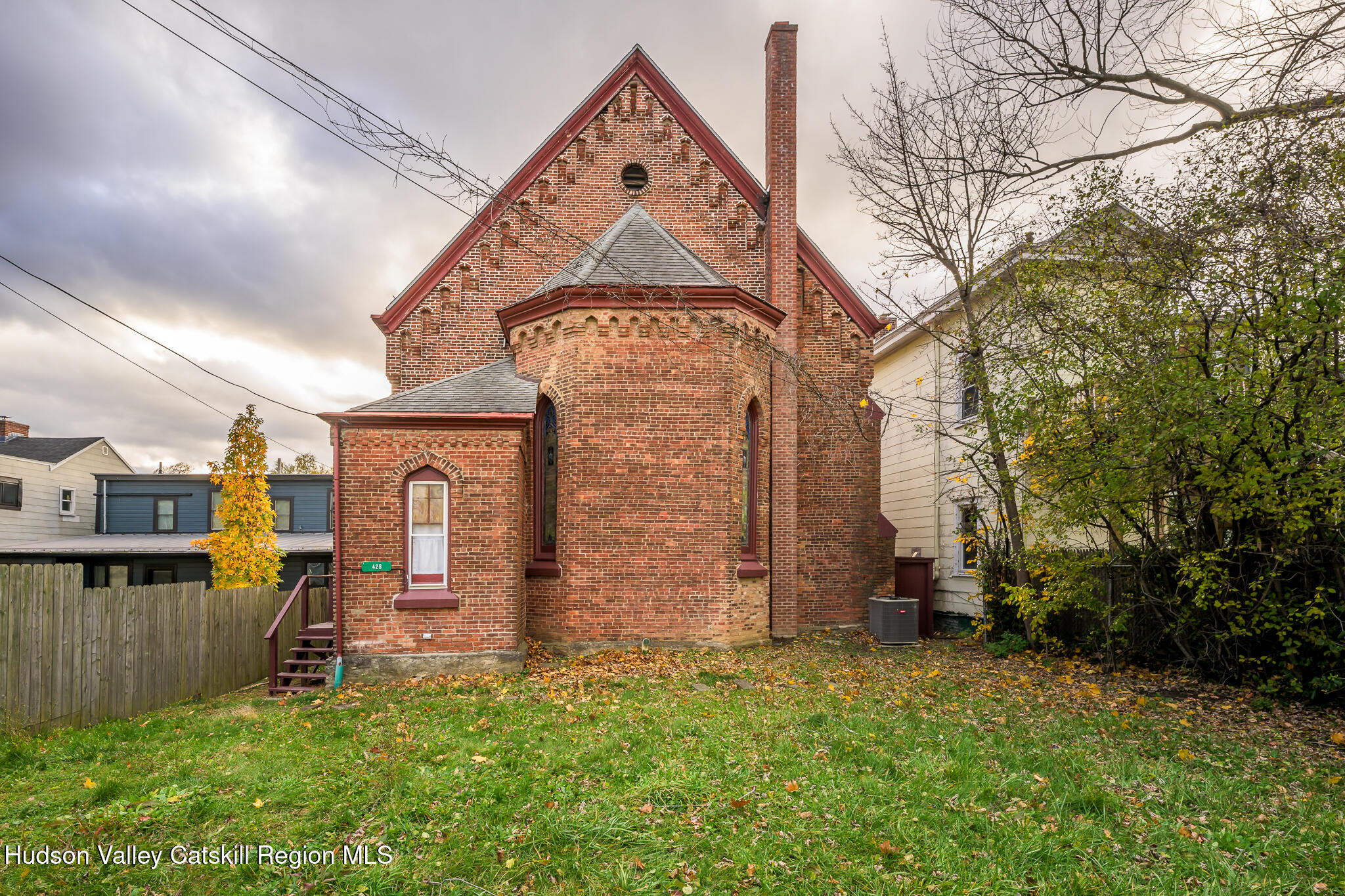 428 State Street Hudson, NY 12534 - Photo 23 of 23 a front view of a house with a yard