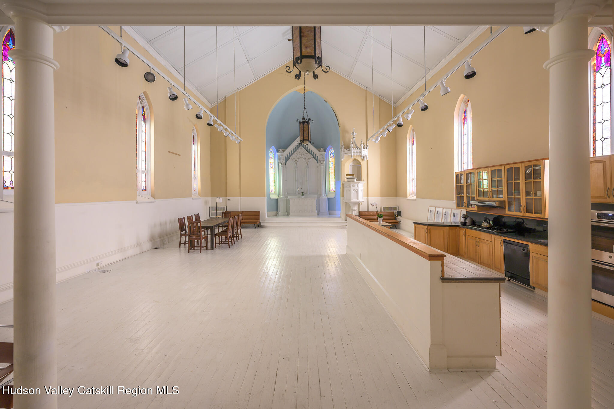 428 State Street Hudson, NY 12534 - Photo 7 of 23 a large white building with glass windows