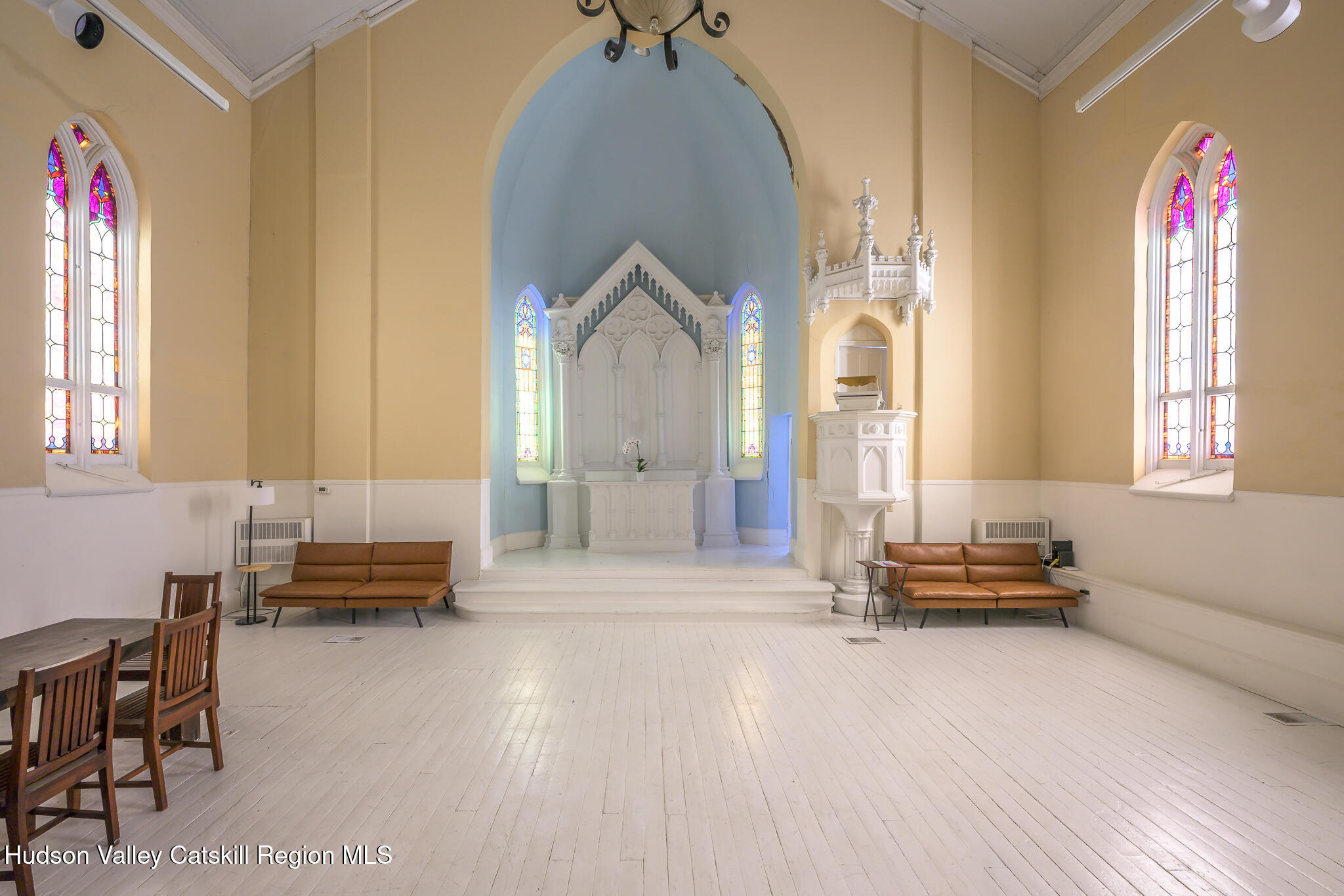 428 State Street Hudson, NY 12534 - Photo 8 of 23 a living room with furniture and a window