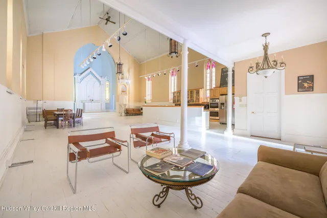a kitchen with stainless steel appliances sink stove top oven and cabinets