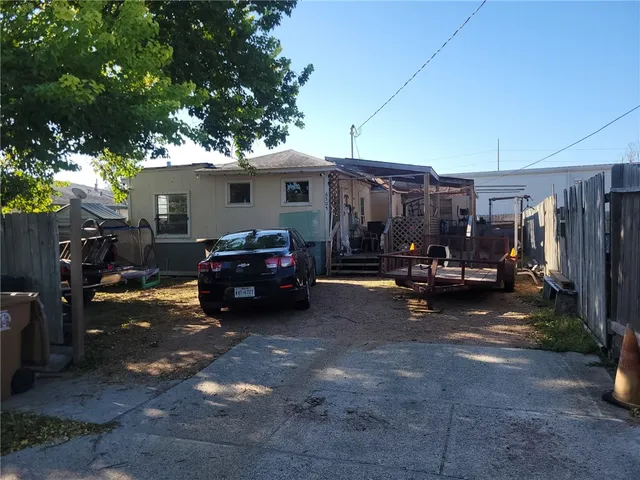 a car parked in front of a house