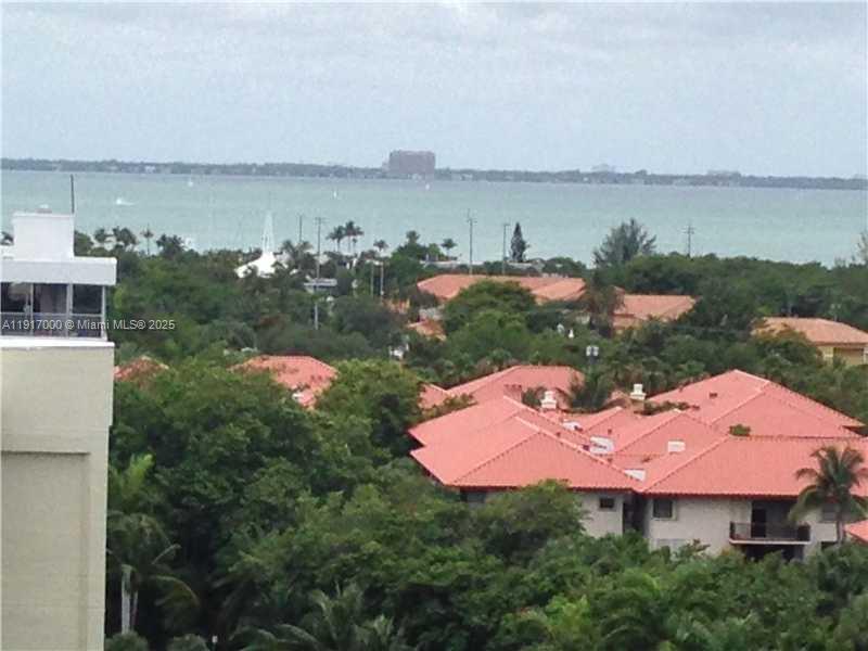 199 Ocean Ln Drive, Unit 1209 Key Biscayne, FL 33149 - Photo 1 of 10 an aerial view of a house with a lake view