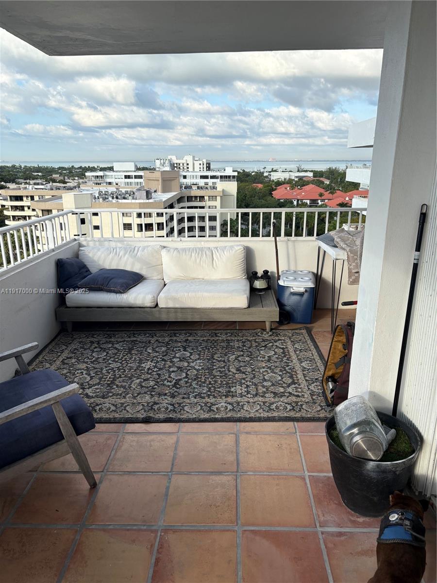 199 Ocean Ln Drive, Unit 1209 Key Biscayne, FL 33149 - Photo 3 of 10 a view of a terrace with lawn chairs