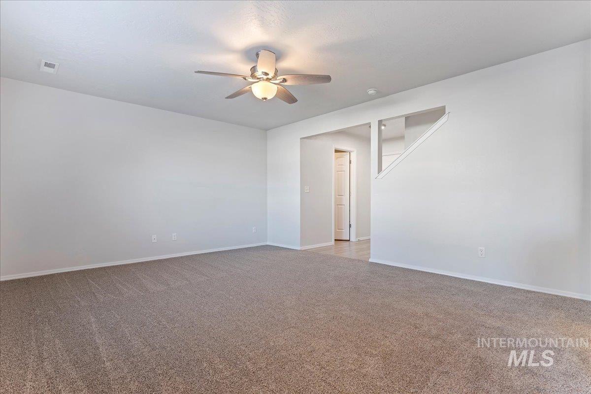 926 West Woodpine Street Meridian, ID 83646 - Photo 11 of 32 Spare room with light carpet and ceiling fan