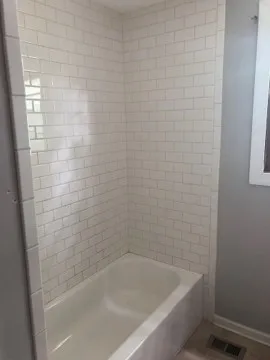 a close up of a bathtub in a bathroom