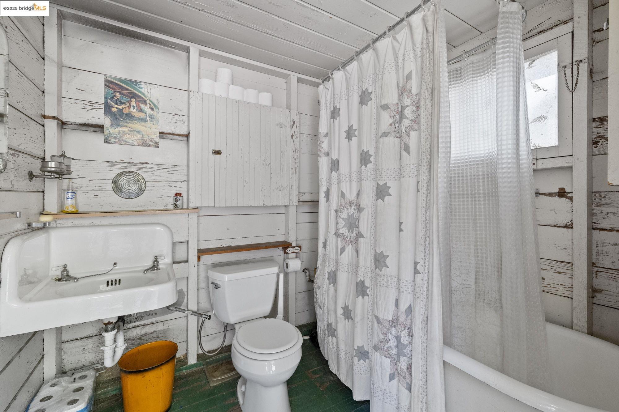 7 Riverside Tract Kyburz, CA 95720 - Photo 15 of 36 a bathroom with a granite countertop toilet and a sink