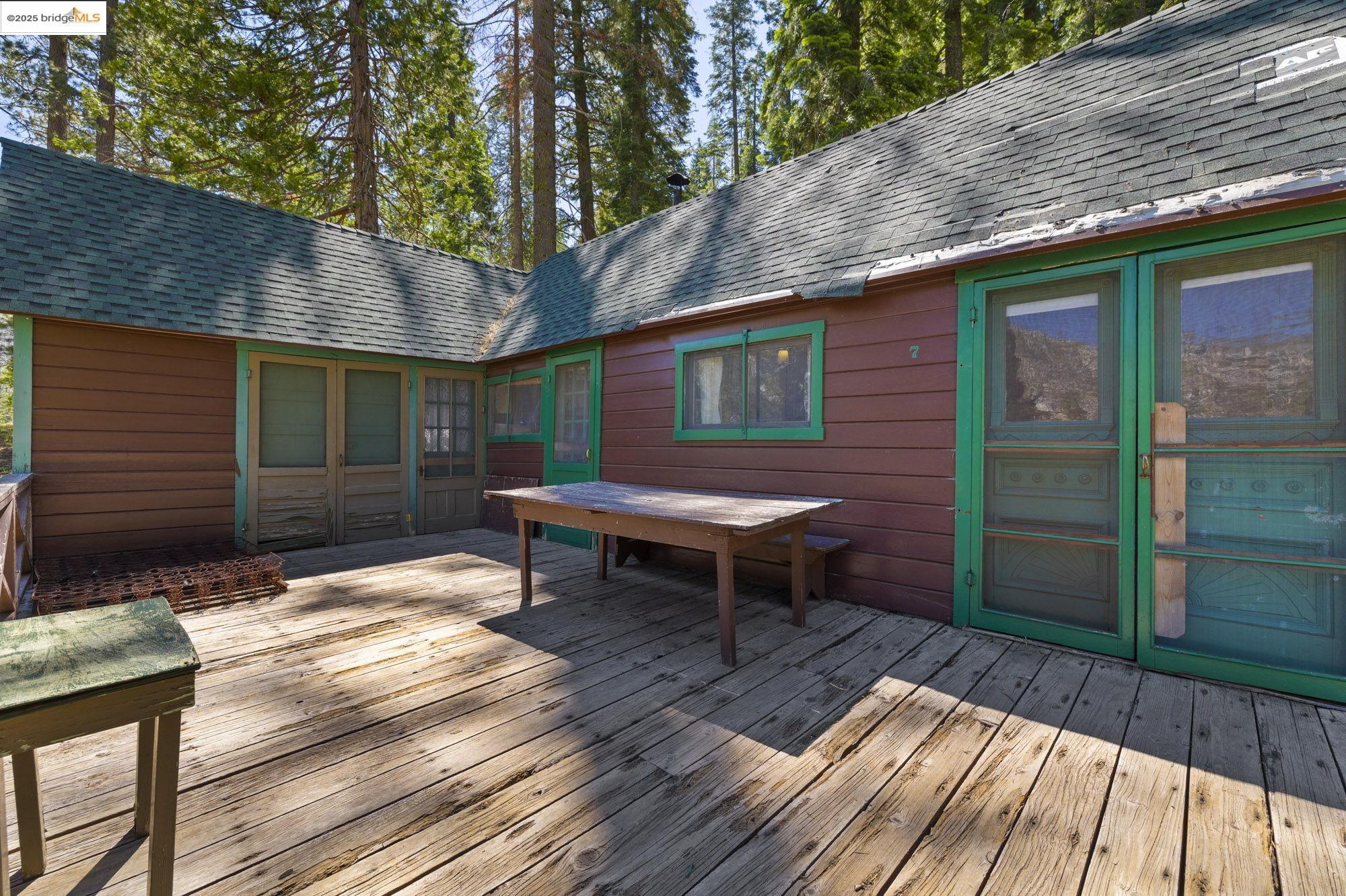 7 Riverside Tract Kyburz, CA 95720 - Photo 21 of 36 a backyard of a house with table and chairs
