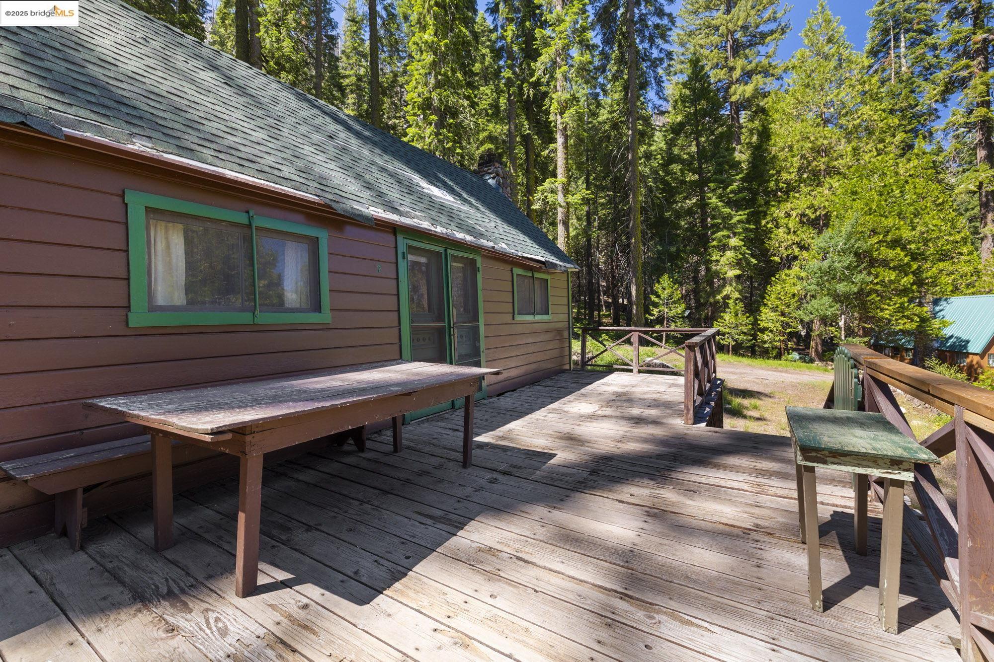 7 Riverside Tract Kyburz, CA 95720 - Photo 22 of 36 a backyard of a house with seating space