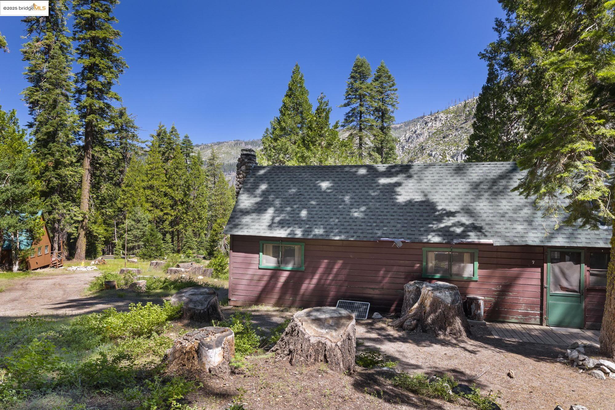 7 Riverside Tract Kyburz, CA 95720 - Photo 26 of 36 a view of a house with a yard