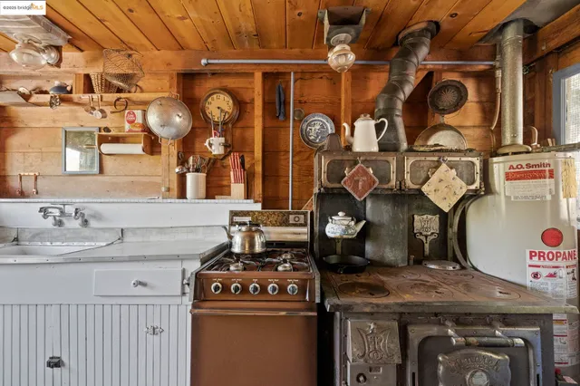 a kitchen with a stove and cabinets
