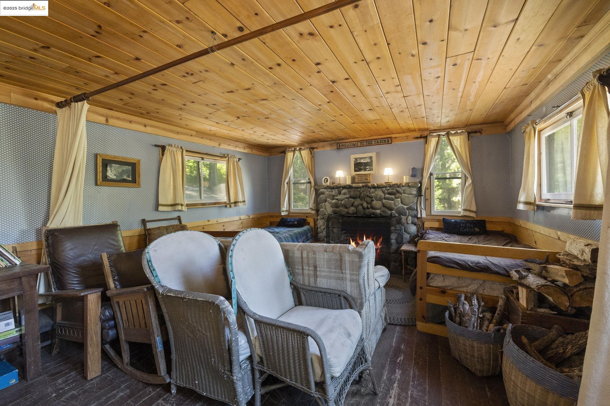7 Riverside Tract Kyburz, CA 95720 - Photo 9 of 36 a living room with furniture and a fireplace
