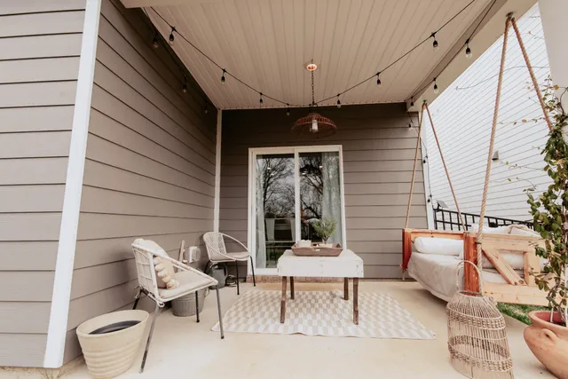 a view of a patio with a table and chairs