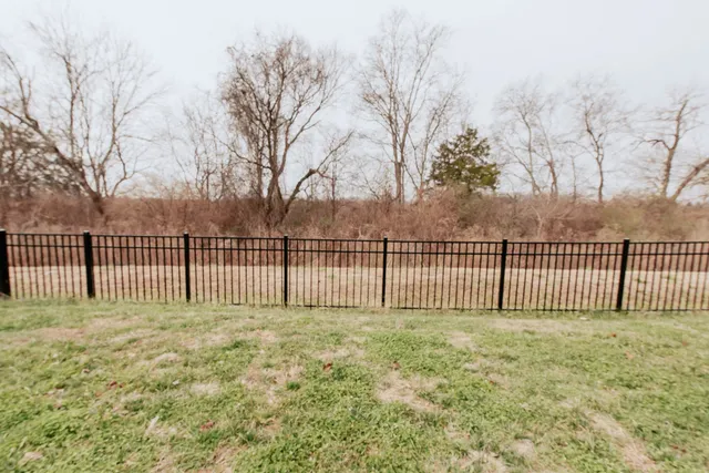 a view of a deck with a fence