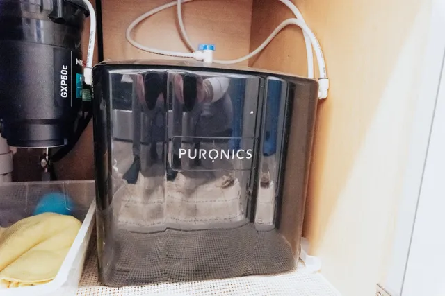 a bathroom with a sink a toilet and shower curtain