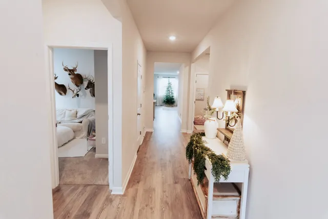 a hallway with view of living room