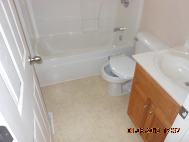 218 Old Martin Chapel Road Portland, TN 37148 - Photo 9 of 11 a white toilet sitting next to a bath tub