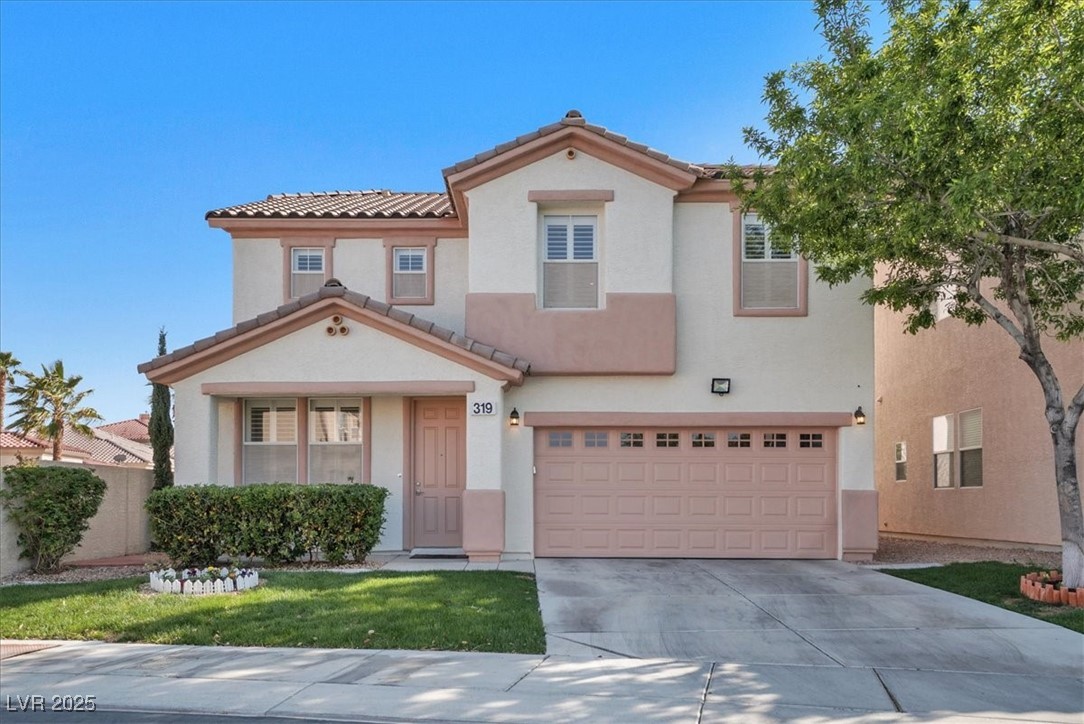 Mediterranean / spanish-style home featuring a garage, driveway, stucco siding, a tiled roof, and a front lawn