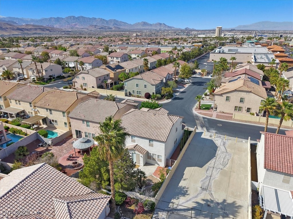 319 Fox Lake Avenue Las Vegas, NV 89148 - Photo 11 of 39 Aerial perspective of suburban area with a mountain backdrop