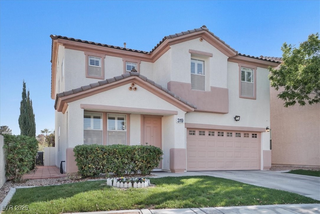 319 Fox Lake Avenue Las Vegas, NV 89148 - Photo 2 of 39 Mediterranean / spanish home with a garage, driveway, stucco siding, and a tile roof