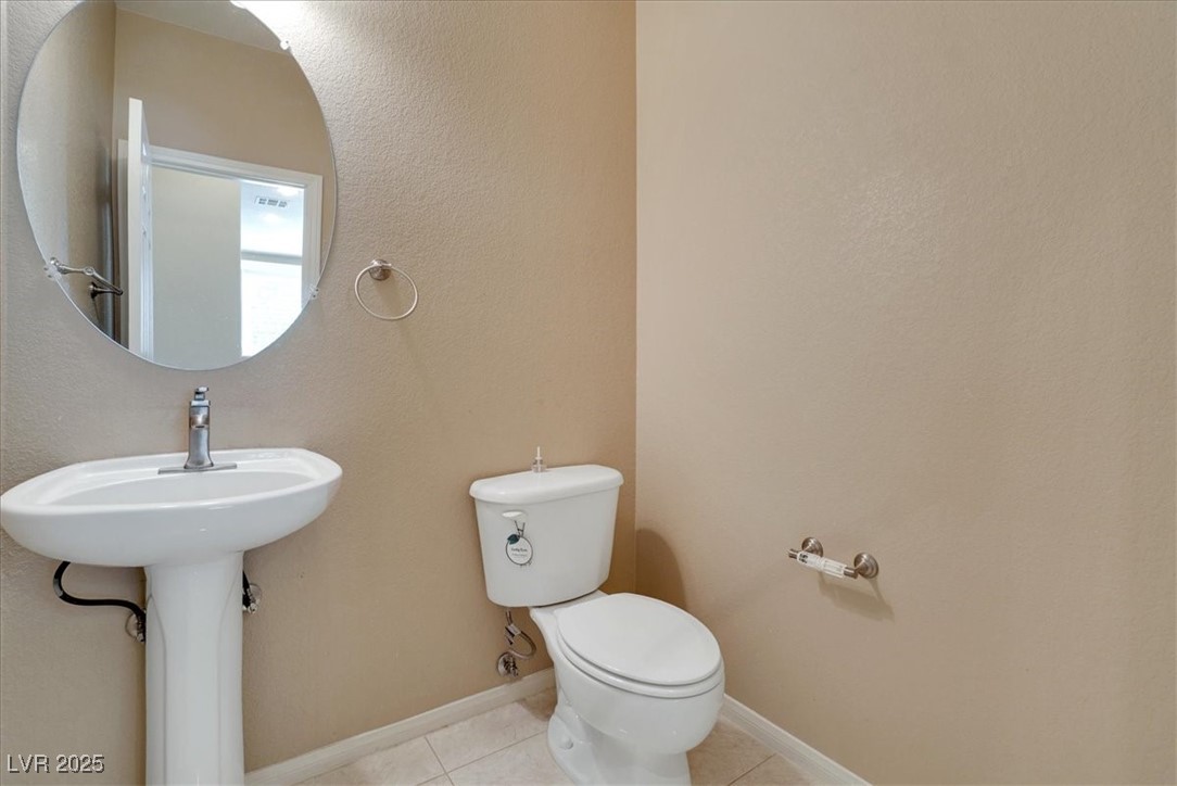 319 Fox Lake Avenue Las Vegas, NV 89148 - Photo 25 of 39 Bathroom featuring tile patterned flooring and a textured wall