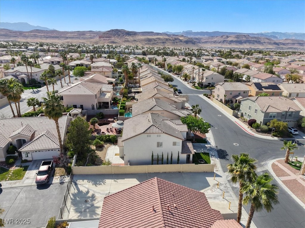 319 Fox Lake Avenue Las Vegas, NV 89148 - Photo 3 of 39 Aerial perspective of suburban area with a mountainous background