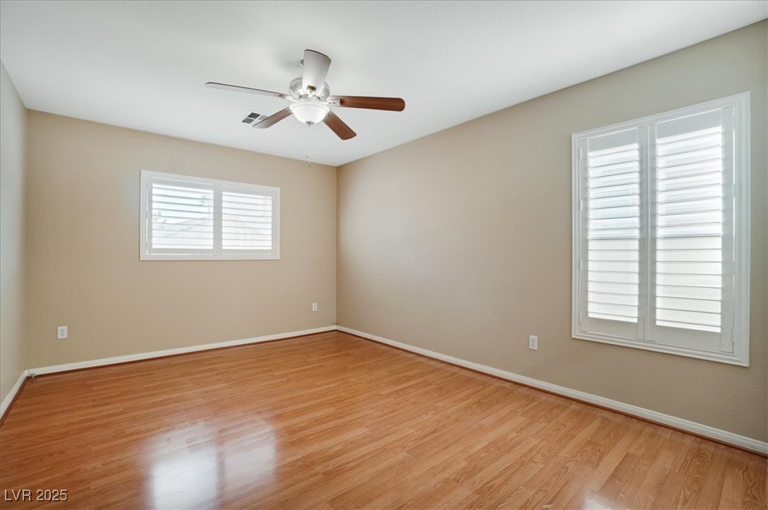 319 Fox Lake Avenue Las Vegas, NV 89148 - Photo 35 of 39 Unfurnished room featuring light wood-type flooring and a ceiling fan