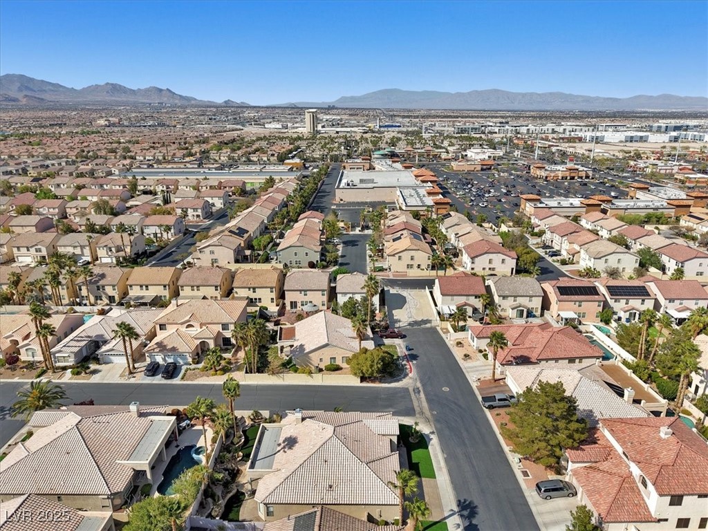 319 Fox Lake Avenue Las Vegas, NV 89148 - Photo 6 of 39 Aerial view of property and surrounding area with mountains and nearby suburban area