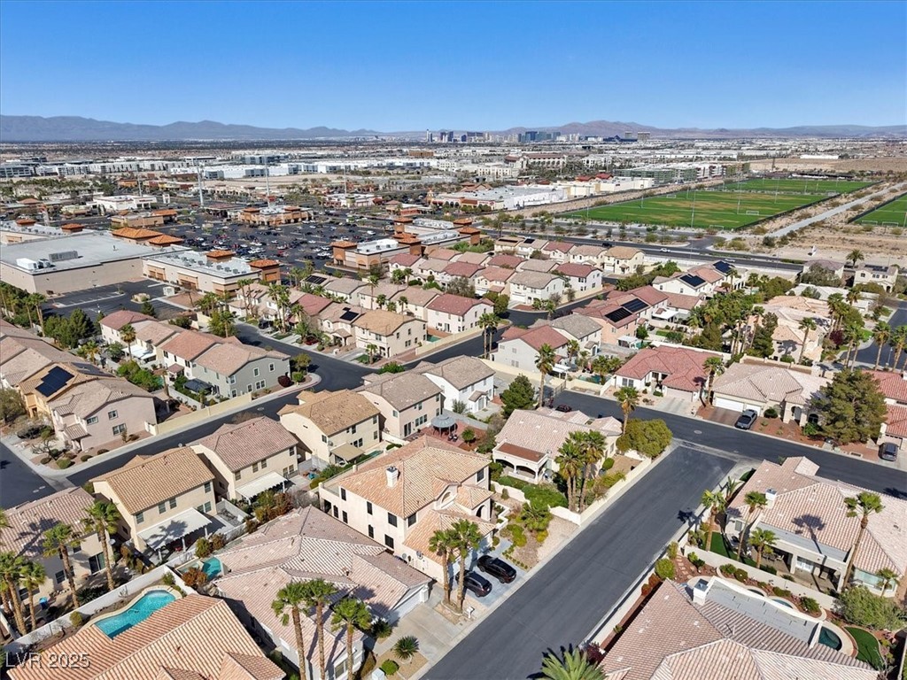 319 Fox Lake Avenue Las Vegas, NV 89148 - Photo 7 of 39 Aerial view of property and surrounding area featuring a mountainous background