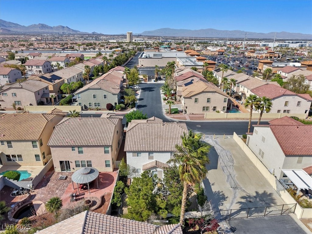 319 Fox Lake Avenue Las Vegas, NV 89148 - Photo 10 of 39 Aerial view of residential area with a mountainous background