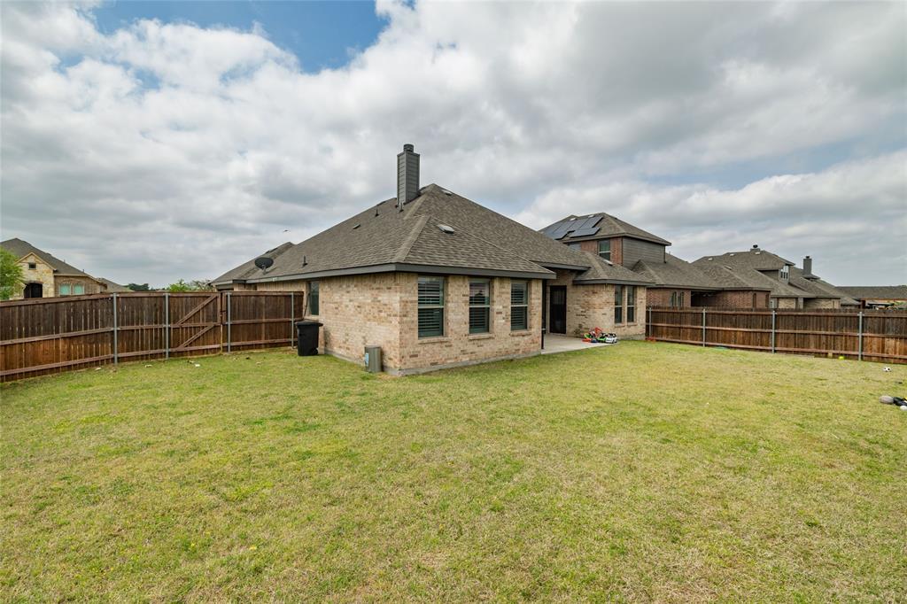 4045 Grove Valley Road Midlothian, TX 76065 - Photo 33 of 34 Rear view of property featuring a patio, a fenced backyard, a chimney, brick siding, and roof with shingles