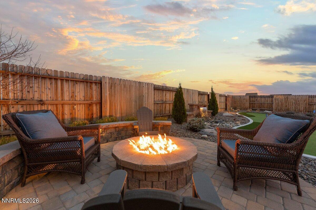477 Scenic Ridge Drive Reno, NV 89506 - Photo 30 of 43 Back Yard Dusk Firepit and Water Feature