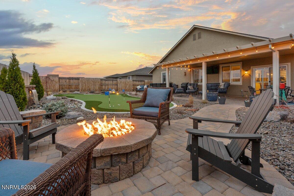 477 Scenic Ridge Drive Reno, NV 89506 - Photo 35 of 43 Backyard Dusk Firepit looking to house