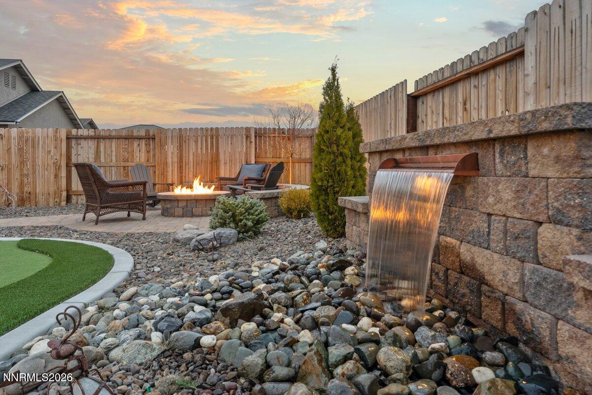 477 Scenic Ridge Drive Reno, NV 89506 - Photo 37 of 43 Backyard Dusk Water Feature to Firepit