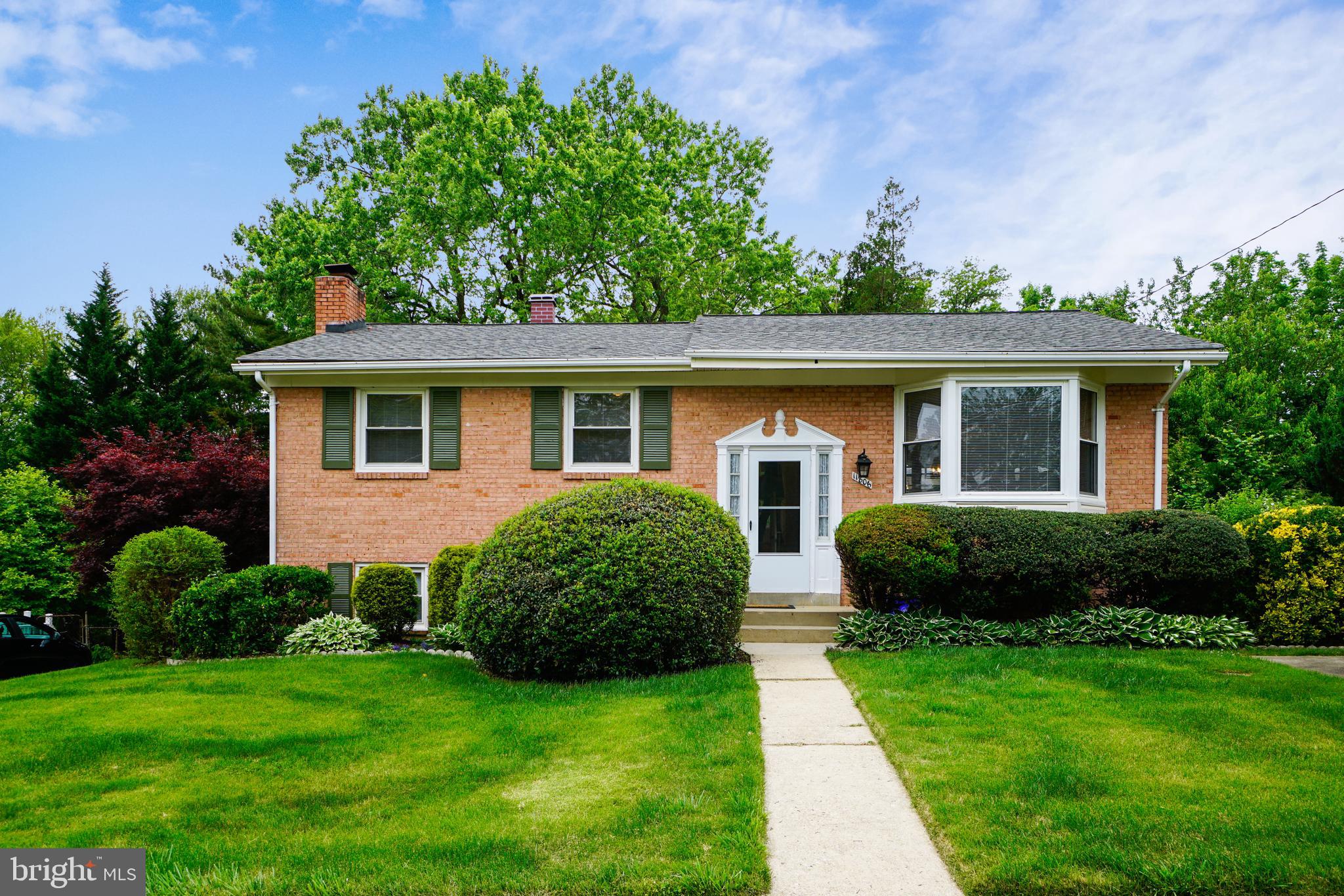 11806 Seven Locks Road Potomac, MD 20854 - Photo 2 of 44 a view of a house with a yard