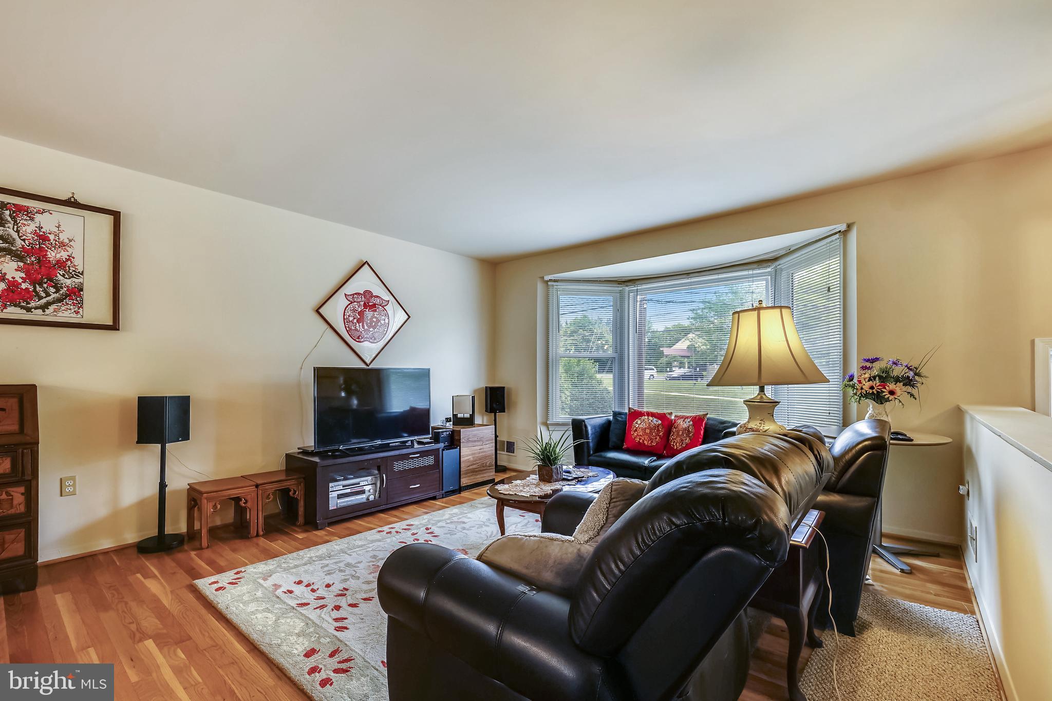11806 Seven Locks Road Potomac, MD 20854 - Photo 12 of 44 a living room with furniture and a flat screen tv