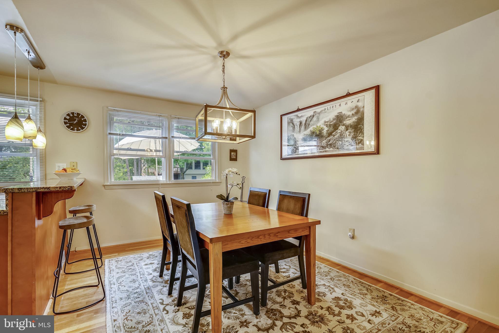 11806 Seven Locks Road Potomac, MD 20854 - Photo 15 of 44 a view of a dining room with furniture window and wooden floor