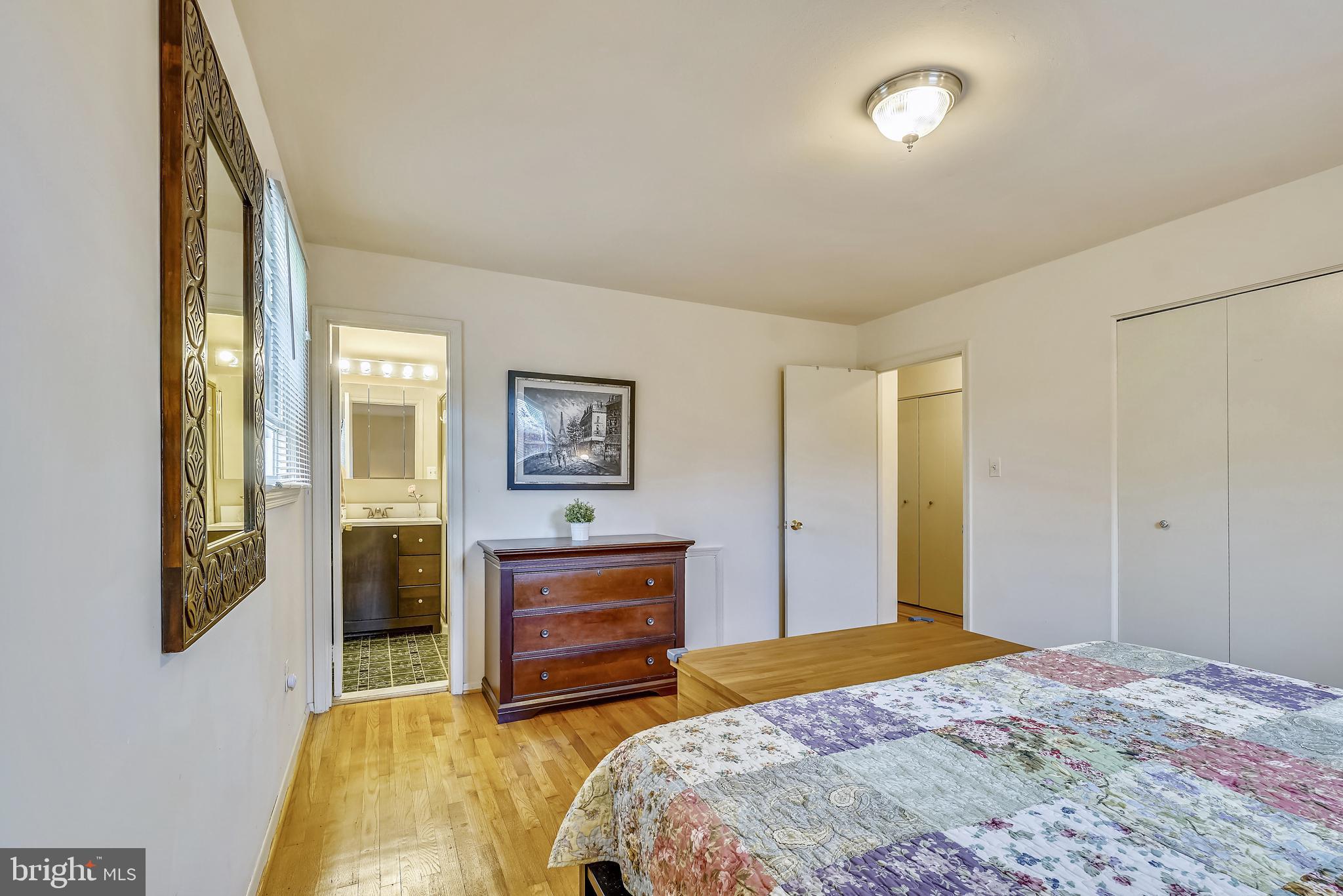 11806 Seven Locks Road Potomac, MD 20854 - Photo 25 of 44 a bedroom with a bed and a chandelier