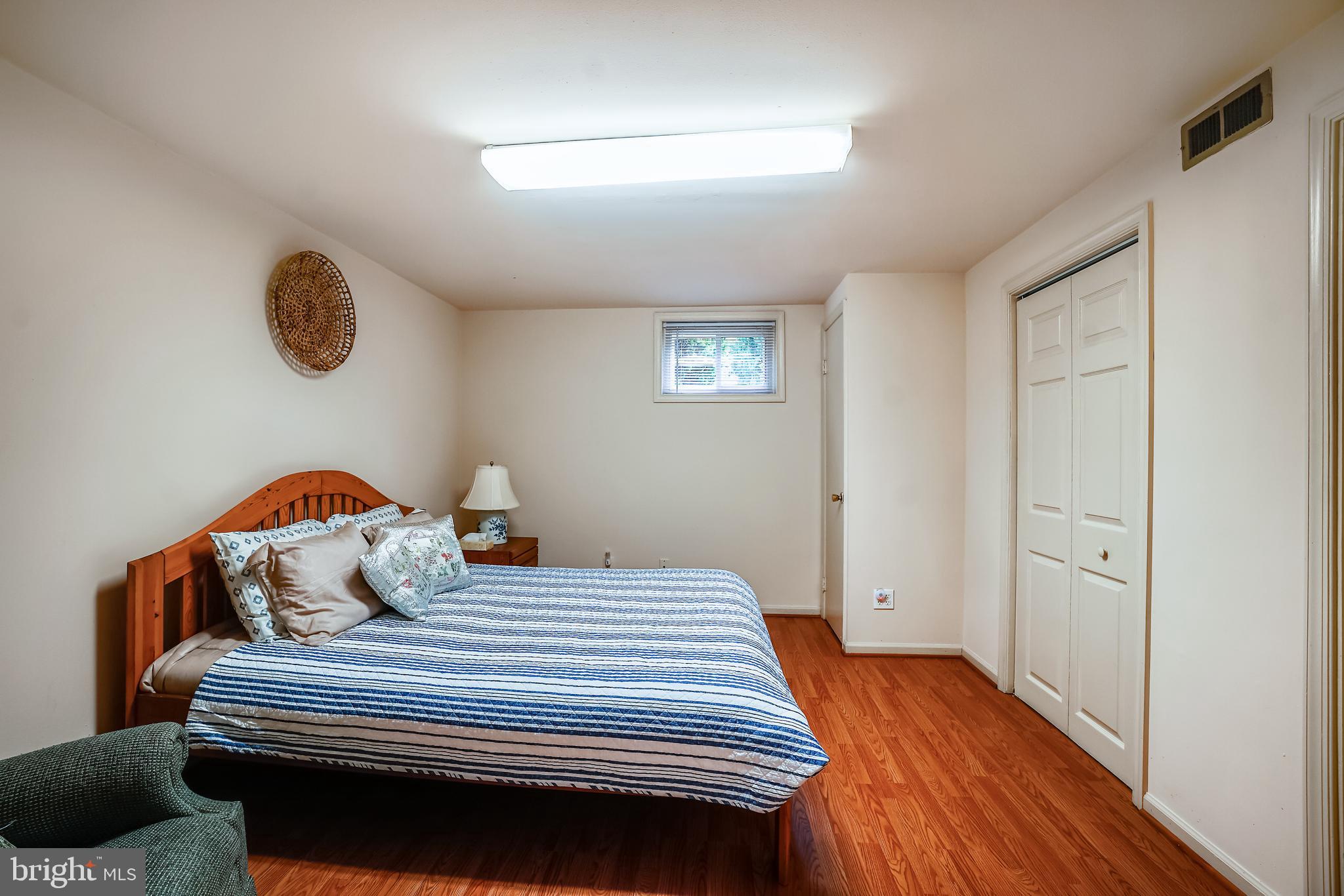 11806 Seven Locks Road Potomac, MD 20854 - Photo 31 of 44 a bedroom with a bed and a window