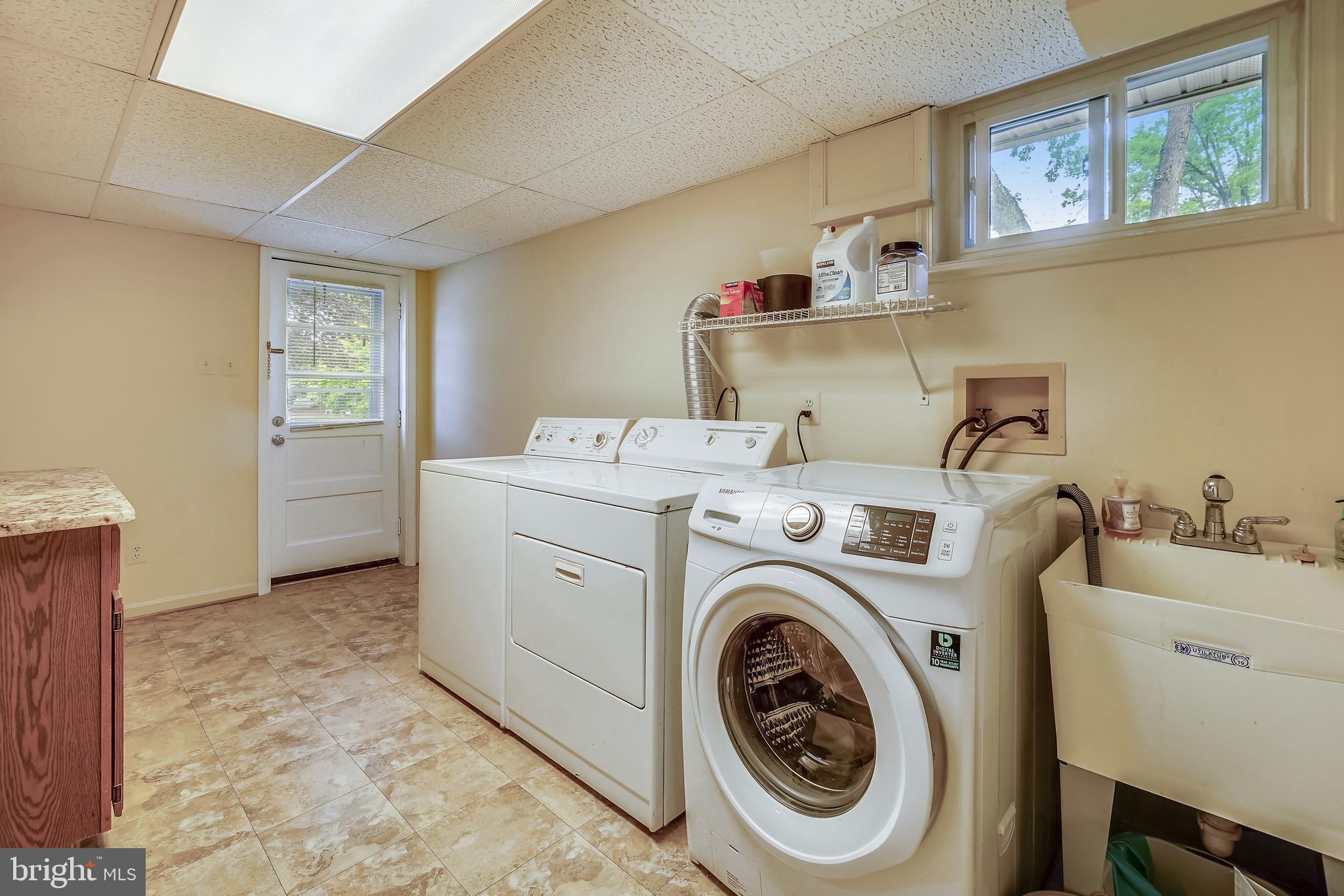 11806 Seven Locks Road Potomac, MD 20854 - Photo 35 of 44 a utility room with dryer and washer