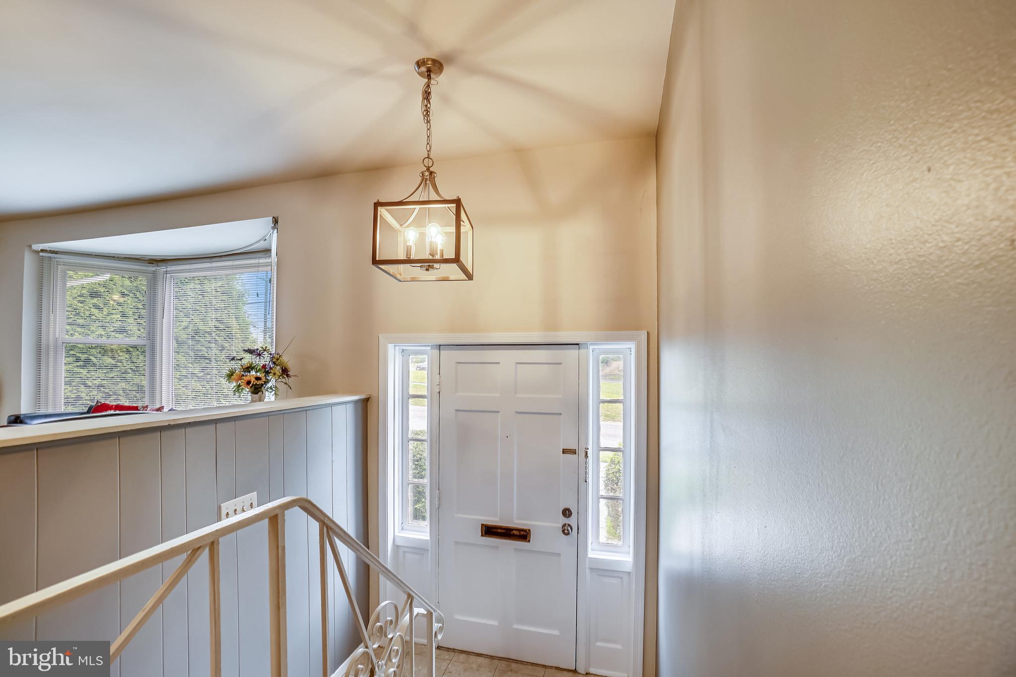 11806 Seven Locks Road Potomac, MD 20854 - Photo 10 of 44 a view of a hallway with a chandelier