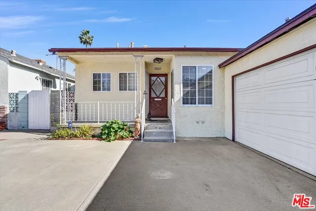 a view of a house with a street
