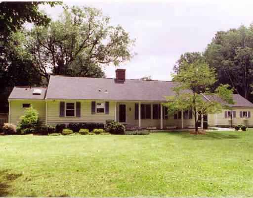 28 Marion Road Westport, CT 06880 - Photo 1 of 1 a front view of house with yard and green space