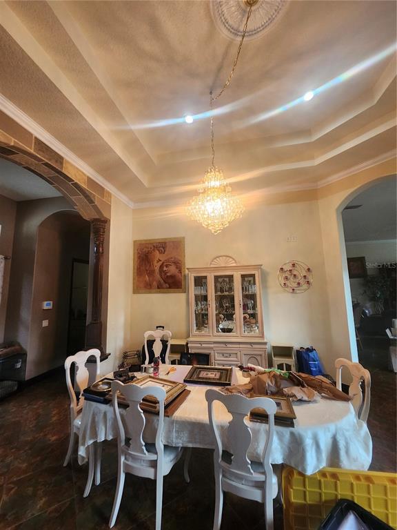 2930 Marsh Road DeLand, FL 32724 - Photo 12 of 30 a view of a dining room with furniture and chandelier