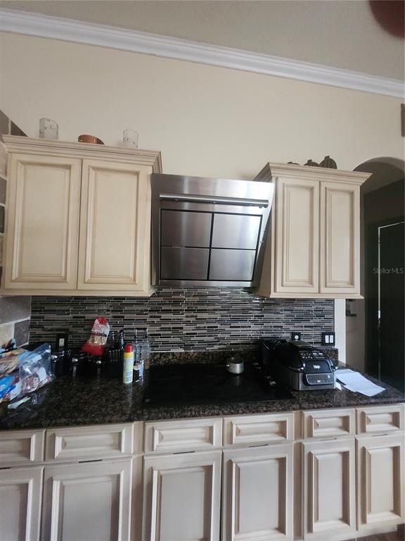 2930 Marsh Road DeLand, FL 32724 - Photo 14 of 30 a kitchen with granite countertop a sink stove and cabinets