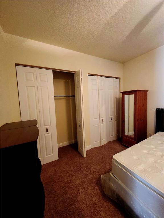 2930 Marsh Road DeLand, FL 32724 - Photo 27 of 30 a bedroom with a bed and a closet