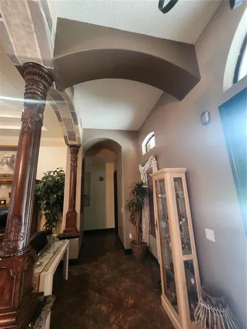 a living room with furniture and a mirror