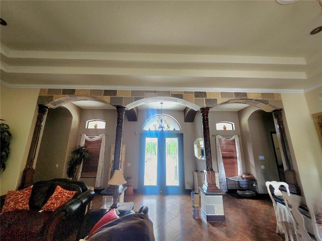 2930 Marsh Road DeLand, FL 32724 - Photo 10 of 30 a living room with furniture and a mirror