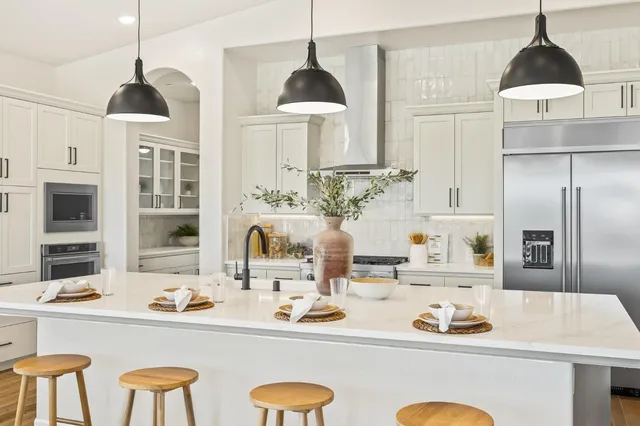 a kitchen with a table and chairs