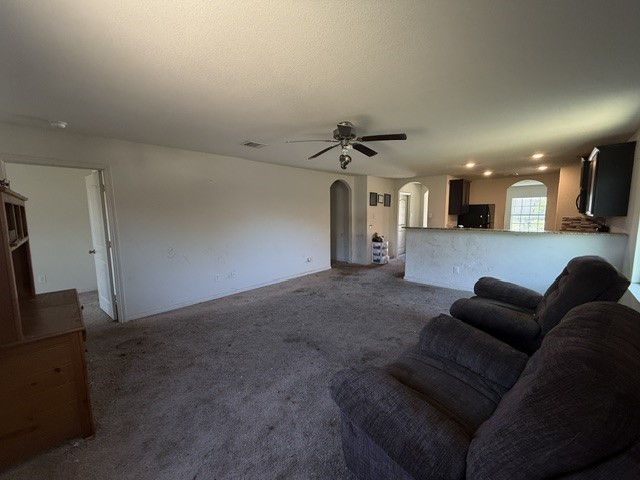 124 Niven Path Jarrell, TX 76537 - Photo 5 of 15 a view of a livingroom with furniture and windows